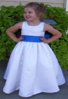 http://www.jaksflowergirldresses.com/fd07034-White-Dress-with-blue-sash.jpg
